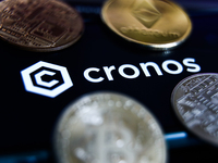 Cronos logo displayed on a phone screen and representation of cryptocurrencies are seen in this illustration photo taken in Krakow, Poland o...