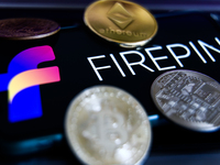 Firepin logo displayed on a phone screen and representation of cryptocurrencies are seen in this illustration photo taken in Krakow, Poland...