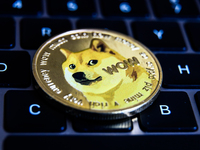 Representation of Dogecoin and a laptop keyboard are seen in this illustration photo taken in Krakow, Poland on June 10, 2022. (
