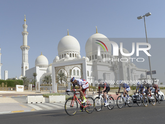 Riders pass in front of the Grande Mosque during The Capital second stage of the 2015 Abu Dhabi Tour, the 129 km from Yas Marina Circuit to...