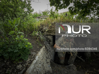 A ukrainian soldier covers himself  in his bunker during the shellings between the russian and ukrainian armies in the frontline of Zaporizh...