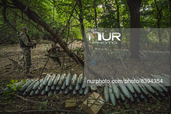 A ukrainian soldier watches howizers hidden in forests near the Zaporizhzhia province prepared for the shelling over the russian positions d...