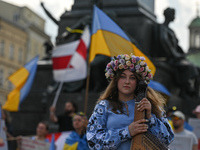 Svetlana Nikonorova, a Ukrainian singer and bandura player, pictured during the protest.
Members of the local Ukrainian diaspora, war refuge...