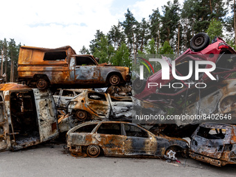 Burned cars are seen on a parking destroyed by bombardment on June 14, 2022 in Irpin, Ukraine.  The cars were collected from the street and...