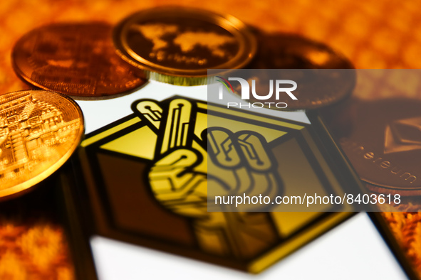 Lucky Block logo displayed on a phone screen and representation of cryptocurrencies are seen in this illustration photo taken in Krakow, Pol...