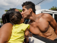 An alleged gang member kisses his family before being brought into a detention center on April 25, 2022 in San Salvador, El Salvador.  (