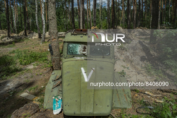 Remains of a russian truck cabin with the V symbol in the forests around Kyiv. Russian troops occupied large extensions of the forests aroun...