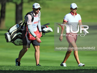 Dewi Weber of Groningen, Netherlands walks with her caddie on the 8th fairway during the first round of the Meijer LPGA Classic golf tournam...