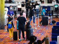 Travellers in the check in area of Changi Airport in SIngapore on Friday, 17 June 2022.  (