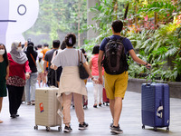 Travellers and visitors in the Jewel Mall of Changi Airport in SIngapore on Friday, 17 June 2022. (