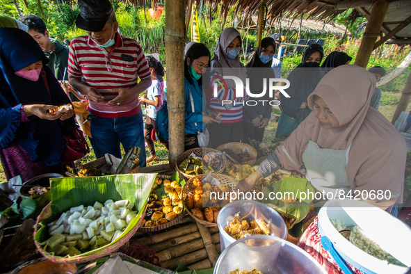 Tourists visit the Sawahan Market, a traditional snack market in Kalongan Village, Ungaran, Central Java, Indonesia on June 19, 2022. 