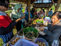 Tourists visit the Sawahan Market, a traditional snack market in Kalongan Village, Ungaran, Central Java, Indonesia on June 19, 2022. (