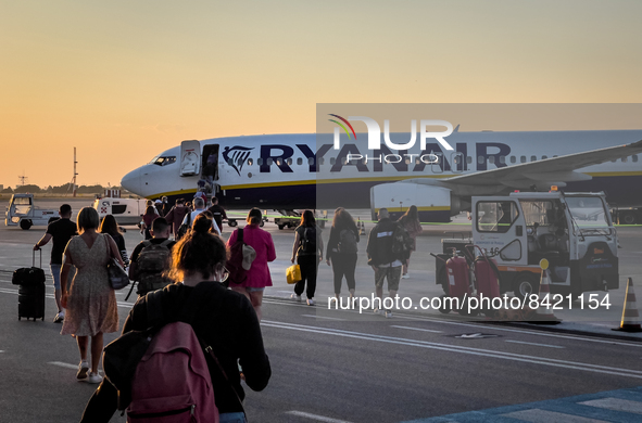 People board in the Ryanair FR4716 at Brindisi Airport, also known as Brindisi Papola Casale Airport and Salento Airport, in Brindisi, Italy...