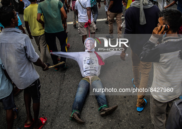 Protesters pull a dummy of Sri Lanka's President Gotabaya Rajapaksa while demanding his resignation, amid the country's economic crisis, in...