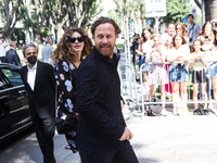 Jan Michelini and Giusy Buscemi arrives at the Emporio Armani fashion show during the Milan Fashion Week S/S 2023 on June 18, 2022 in Milan,...