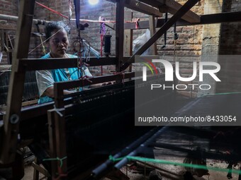 A worker weaver making textiles at the traditional weaving workshop at Troso village in Jepara, Central Java Province, Indonesia on June 21,...