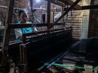 A worker weaver making textiles at the traditional weaving workshop at Troso village in Jepara, Central Java Province, Indonesia on June 21,...