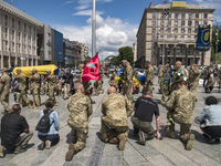 Relatives, friends and comrades attend the funeral ceremony for Oleg Kutsyn, commander of Karpatska Sich battalion, who was killed in a batt...