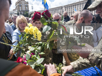 Relatives, friends and comrades attend the funeral ceremony for Oleg Kutsyn, commander of Karpatska Sich battalion, who was killed in a batt...