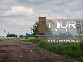 A sign mentioning Donec'k Region is seen between the villages of Temyrivs'ka and Zelene Pole, Ukraine, on june 22, 2022.(