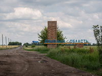 A sign mentioning Donec'k Region is seen between the villages of Temyrivs'ka and Zelene Pole, Ukraine, on june 22, 2022.(