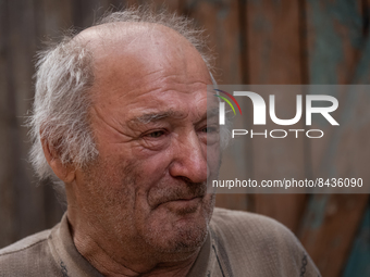 Nykolaj, 73 y.o. is portrayed in front of what remains of his house, in the villahe of Zelene Pole, Ukraine, on june 22, 2022.(