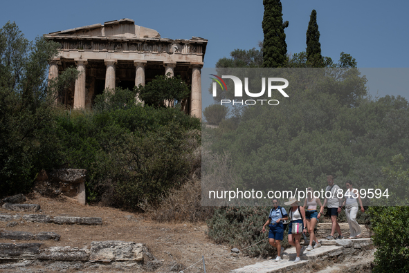Tourists visit the temple of Hephaestus  during a heatwave in Athens, Greece, on June 23, 2022 