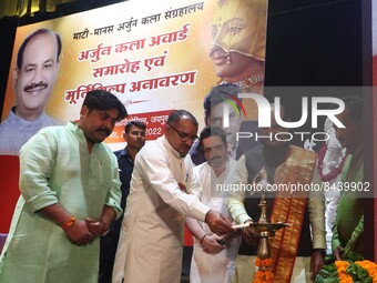 Lok Sabha Speaker Om Birla with RSS leader Nimba Ram lighting the lamp during Arjuna Art award ceremony organised by Mati Manas Arjun Kala S...