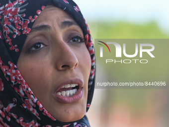 Tawakkol Karman, a Yemeni Nobel laureate, journalist, politician, and human rights activist, speaks with a local journalist during a visit t...