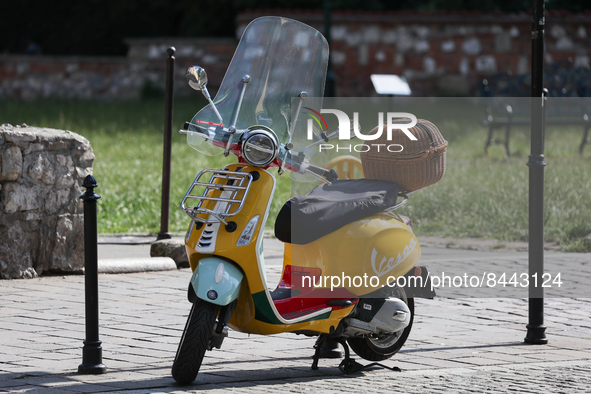 Vespa scooter is seen parked in Krakow, Poland on June 23, 2022. 