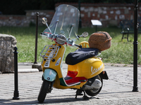 Vespa scooter is seen parked in Krakow, Poland on June 23, 2022. (