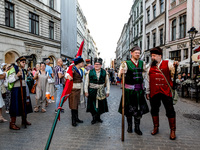 A man dressed as Polish Middle Ages nobility participate in a parade of Lajkonik, a folklore tradition connected with history of Krakow in a...