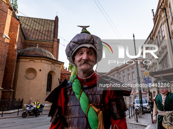 A man dressed as Tatar walks in a parade of Lajkonik, a folklore tradition connected with history of Krakow in an Old Town of Krakow, Poland...