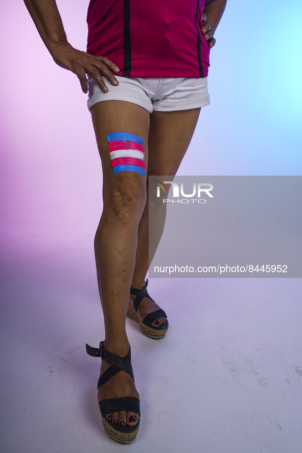 Ivania Coluchi, 50, transgender, poses with a transgender pride flag during a photoshoot on June 23, 2022 in San Salvador, El Salvador. Ever...