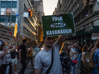 Protestors hold signs during a protest against the Supreme Courts decision to overturn Roe V. Wade on Friday June 24, 2022 in New York, NY....