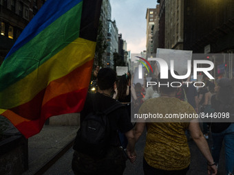 Protestors hold a pride flag during a protest against the Supreme Courts decision to overturn Roe V. Wade on Friday June 24, 2022 in New Yor...