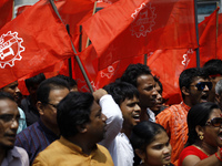 Garment workers take part in a rally in front of press club organized by United Federation of Garment Workers in Dhaka demanding compensatio...