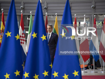 Kyriakos Mitsotakis Prime Minister of Greece as seen arriving to the European Council summit next to the European flags and flag of Europe a...
