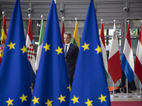 Kyriakos Mitsotakis Prime Minister of Greece as seen arriving to the European Council summit next to the European flags and flag of Europe a...