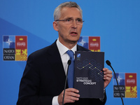 NATO Secretary General Jens Stoltenberg shows NATO 2022 Strategic Concept at the press conference during the NATO Summit in Madrid, Spain on...