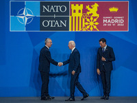 Secretary General of NATO, Jens Stoltenberg, left, shakes the hand of the president of the United States of America, Joe Biden, center, in p...