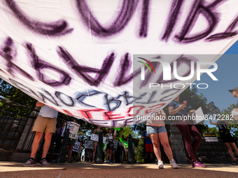 Pro-choice demonstrators prepare their banner to march outside Senate office buildings on Capitol Hill, demanding Democrats take action to r...