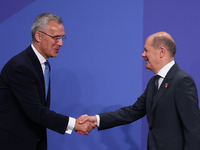 NATO Secretary General Jens Stoltenberg and Chancellor of Germany Olaf Scholz during the welcome ceremony of the NATO Summit in Madrid, Spai...