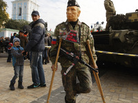An activist wearing a mask depicting Russian President Vladimir Putin,during a 