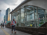 A woman wear protective face masks while walking at pedestrian in Jakarta on 5 July 2022. The Indonesian government on Tuesday, July 5, rais...
