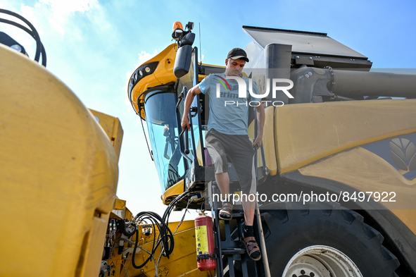 ZAPORIZHZHIA REGION, UKRAINE - JULY 05, 2022 - A harvester operator is seen in the field during the grain harvesting. Due to the ongoing hos...