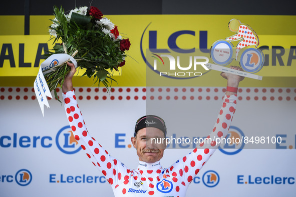 EF Education-Easypost team's Danish rider Magnus CORT NIELSEN wearing the best climber polka dot jersey celebrates on the podium during...