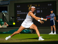 Marie Bouzkova of the Czech Republic in action against Ons Jabeur of Tunisia during the quarter-final of the 2022 Wimbledon Championships, G...