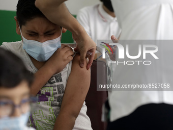 A child receives a Pfizer first dose at the  Portales Health Center during a health campaign to children under 9 years of age  at the start...