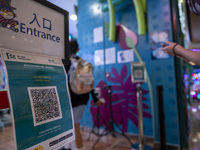 The Leave Home Safe QR code placed at the entrance of a store inside a shopping mall on July 15, 2022 in Hong Kong, China. (